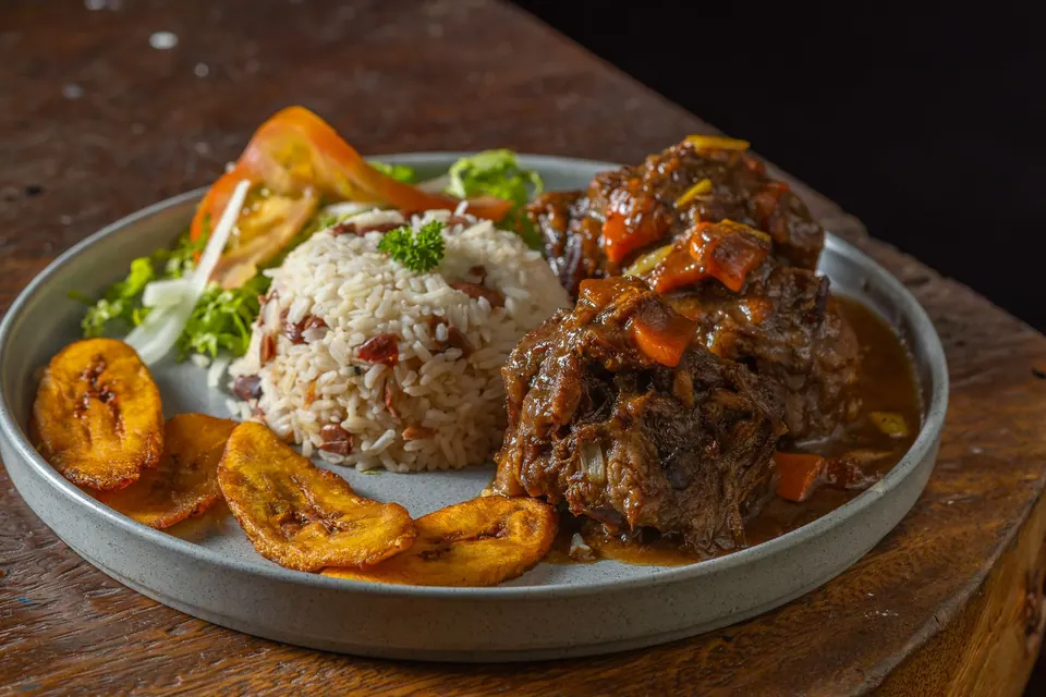 Ox Tails with rice and peas, cabbage and sweet plantain